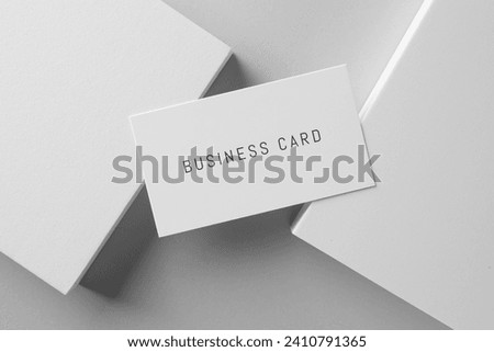 Business card on white background, top view
