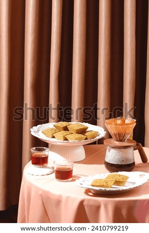 cake and coffee on the table against brown background
