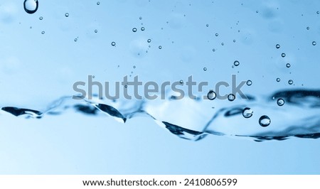 Water droplets on glass and water surface