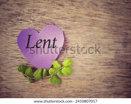 Lent Season, Holy Week and Good Friday concepts - Lent text on purple heart shape paper with flora background. Stock photo.