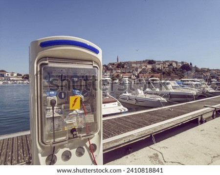 Picture of a power loading terminal for yachts at the port of Vrsar in Croatia during the day