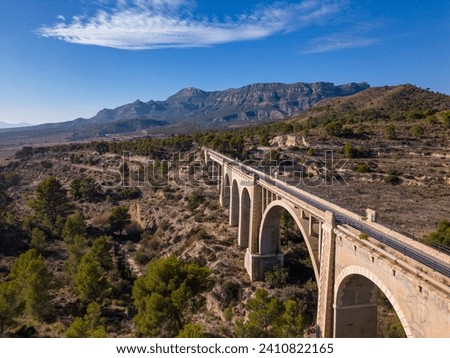 Old bridge on the Maigmó Greenway, a fascinating 22 kilometer route that follows in the footsteps of the old railway route, Alicante, Spain  - stock photo