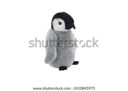 cute little penguin stuffed animal   puppet doll plaything for kids isolated on white background. child soft toys collection. top view character puppet. grey color penguin
