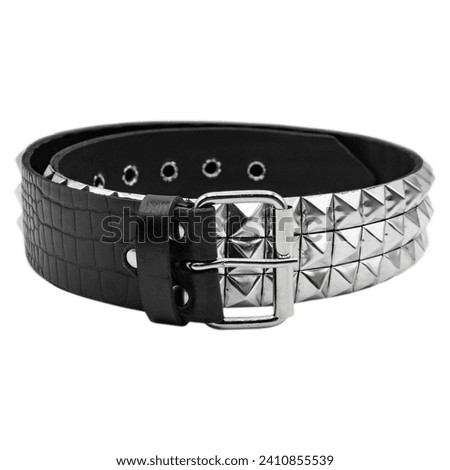 Leather belt with accessories. Belt with metal studs in the form of a pyramid. Accessories and decorations for mtalheads, rockers, punks, bikers, goths.