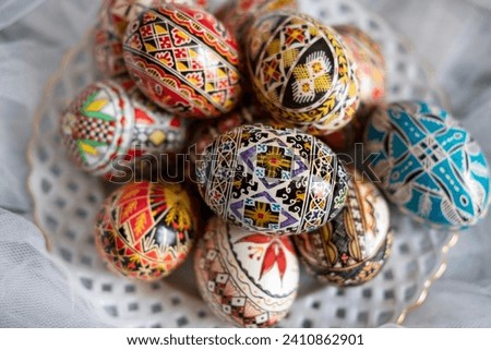 Intricate Easter eggs, part of the Northern Romanian custom of wax coloring and painting elaborate traditional symbols and motifs on the eggshell with a special tool, a drawing pen known as "chisita"