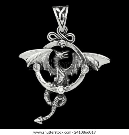 Silver dragon with wings pendant. 925 silver. Accessories for rockers, metalheads, punks, goths. Royalty-Free Stock Photo #2410866019