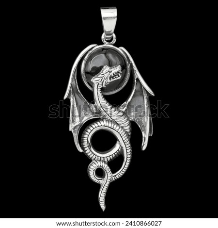Silver dragon with wings pendant. 925 silver. Accessories for rockers, metalheads, punks, goths. Royalty-Free Stock Photo #2410866027