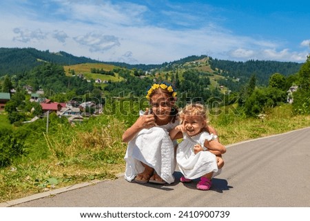 Children against the background of mountains. Selective focus. Nature.
