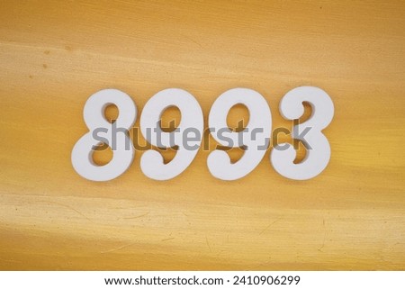 The golden yellow painted wood panel for the background, number 8993, is made from white painted wood.