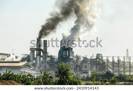 A metal factory emits smoke and smog which causes harmful environmental pollution. and destroy the ecosystem, photography captures this environmental impact.