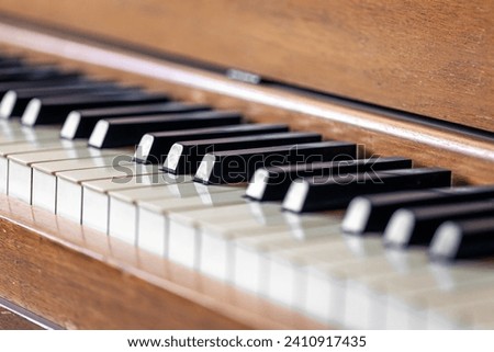 Close-up, keys of an antique wooden piano.