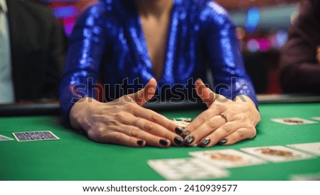 Anonymous Woman in a Glamorous Evening Dress Collecting her Prize of Poker Chips in a Casino. Lucky Professional Lady Winner Hitting the Jackpot, Happilly Celebrating Her Victory. Close-up Royalty-Free Stock Photo #2410939577