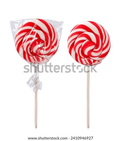 Lollipop in packaging and without close-up on a white background. Isolated Royalty-Free Stock Photo #2410946927