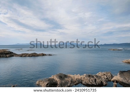 Views from Mallaig, picturesque port town on the Scottish western coast towards the Inner Hebrides islands known as The Small Isles, solitary landscape showing the familiar wild beauty of Scotland, UK Royalty-Free Stock Photo #2410951735