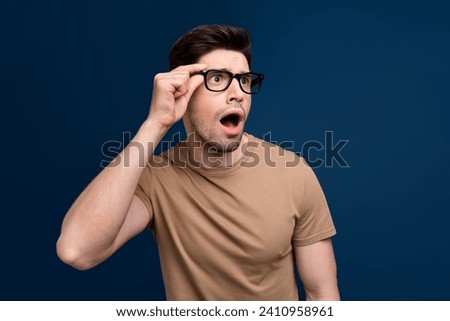 Photo of shocked impressed stylish man open mouth look empty space unexpected unbelievable offer isolated on dark blue color background Royalty-Free Stock Photo #2410958961