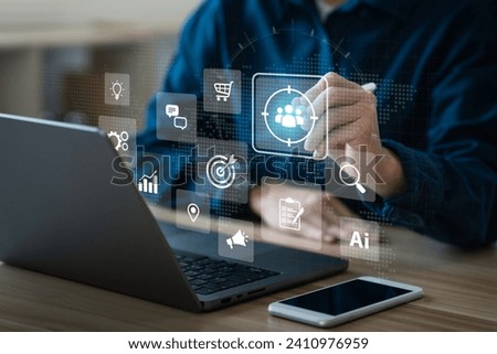 Businessman touching on screen to target customer. for buyer persona. customer behavior analysis concept. Marketing plan and strategies. Personalization marketing, customer-centric strategies. Royalty-Free Stock Photo #2410976959
