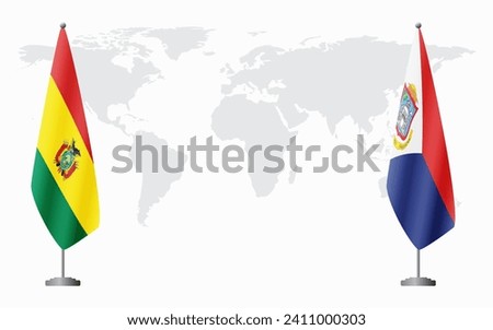 Bolivia and Sint Maarten flags for official meeting against background of world map.