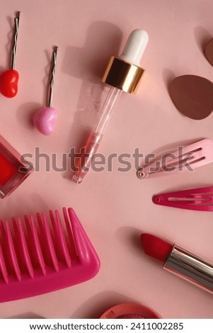 Various pink accessories and make up products on bright pink background. Flat lay.