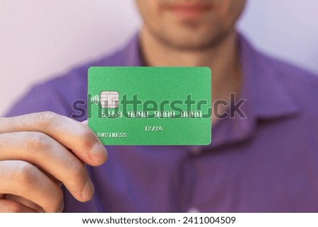 Close up male hand hold credit card. Bussines.