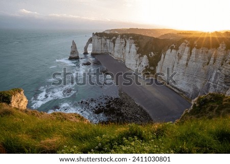 Picturesque panoramic landscape on the cliffs of Etretat. Natural amazing cliffs. Etretat, Normandy, France, La Manche or English Channel. Coast of the Pays de Caux area in sunny summer day. France Royalty-Free Stock Photo #2411030801