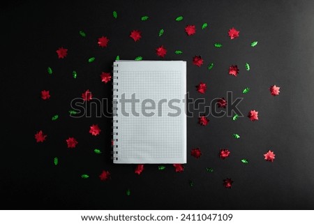 top view photo of notebook, writing in spiral notepad letter to santa on isolated black background with copyspace. Concept happy new year, merry Christmas, valentines day
