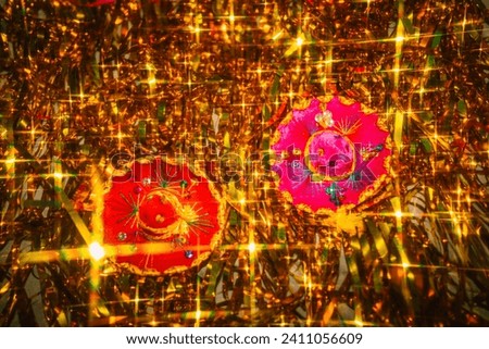 Miniature pink, red, gold sombreros on festive, sparkling golden tinsel backdrop	 Royalty-Free Stock Photo #2411056609