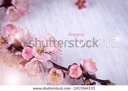 Happy Nowruz festive banner with Apricot Tree branch with pink flowers. Persian New Year Holiday Concept.
