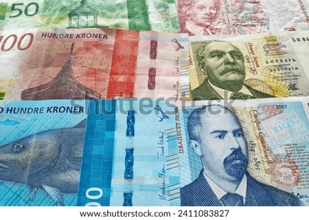 Close-up on a stack of Norwegian krone and Bulgarian Lev.