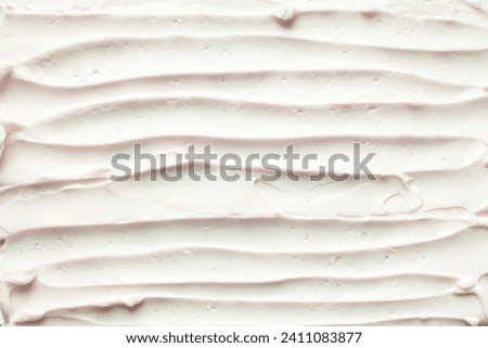Top view of pink buttercream for decorating cake, silky smooth american buttercream on a marble surface, overhead view of smooth buttercream Royalty-Free Stock Photo #2411083877