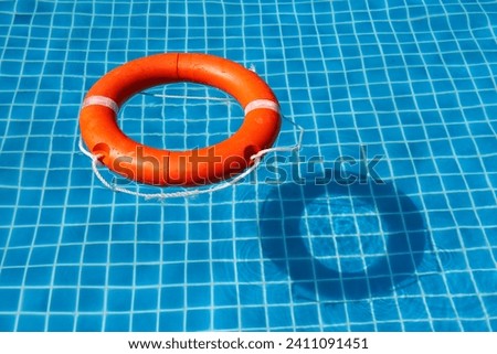 A view from above of the pool in which the life preserver is thrown. Royalty-Free Stock Photo #2411091451