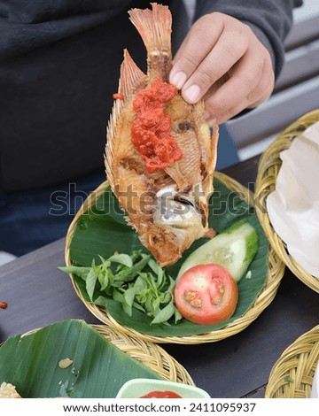 This is a picture of Indonesian local food, and here is a pic of fried fish with chili sauce