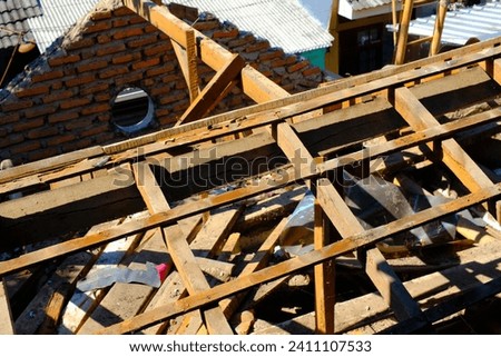 Industrial Photography. Construction Works. Photo of the roof frame of the house during demolition. Roof removal for metal deck installation. Bandung, Indonesia