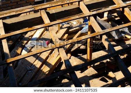 Industrial Photography. Construction Works. Photo of the roof frame of the house during demolition. Roof removal for metal deck installation. Bandung, Indonesia