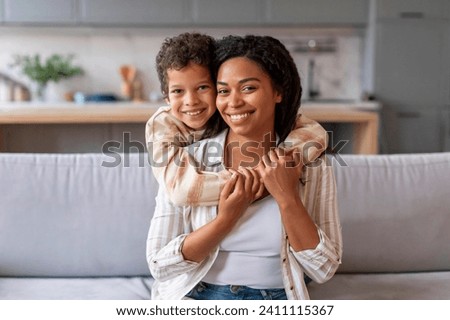 Mother Son Love. Happy Black Woman And Preteen Son Hugging At Home, Loving African American Family Of Two Mom And Male Kid Bonding And Enjoying Spending Time With Each Other, Copy Space Royalty-Free Stock Photo #2411115367