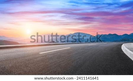 Asphalt highway road and mountain with sky clouds landscape at sunset Royalty-Free Stock Photo #2411141641