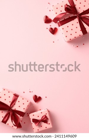 Romantic Valentines Day vertical banner with gifts and hearts on pink background. Flat lay, top view.