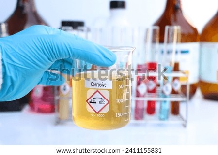 Corrosive Symbols of chemicals in test tubes, chemicals in the laboratory or industry Royalty-Free Stock Photo #2411155831