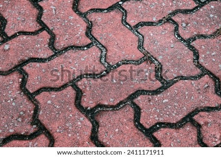 A close up of a red brick sidewalk
