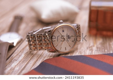 stunning elegant gold timepiece. Swiss made wristwatch with a sleek bracelet. Royalty-Free Stock Photo #2411193835