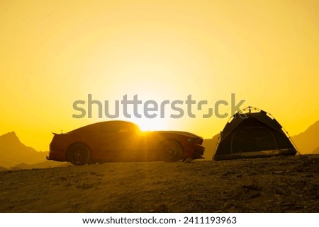 Camping tent and car in the top of mountain in the sunrise with Silhouette wide view Photo Suhaila Lakes Hatta Dubai
