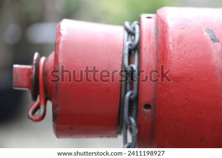 Fire hydrants and fire extinguisher nozzles for safety and protection, are colored red to be clearly visible in public places. Closeup of large bolts on the floor