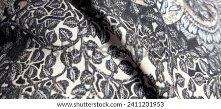 black cloth with batik motifs