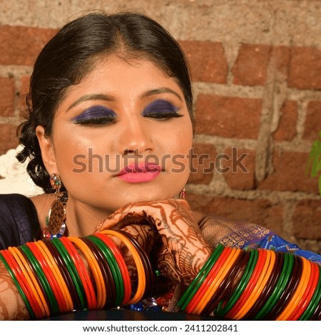 Beautiful bridal portrait of Indian bride wearing blue saree