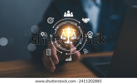 Business ethics concept. Ethical investment, sustianable development. Business integrity and moral. Businessman touching on BUSSINESS ETHICS wording on smart screening surrounded by ethical elements. Royalty-Free Stock Photo #2411202885