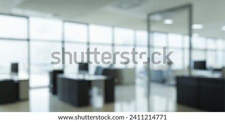 Beautiful blurred background of a light modern office Royalty-Free Stock Photo #2411214771