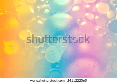 The picture of the oil on the water surface is soft and has rainbow gradations. Some parts are soft and unclear.