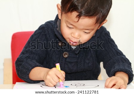 Japanese boy drawing a picture