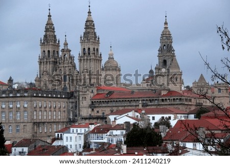 Photo of a view of the Cathedral of Saint James (Catedral de Santiago de Compostela) in the historic center of the city of Santiago de Compostela in the region of La Coruna, in northern Spain Royalty-Free Stock Photo #2411240219