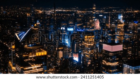 Aerial View of Manhattan Architecture at Night. Evening Photo of Financial Business District from a Helicopter. Scenery of Historic Office Towers, Illuminated Skyscrapers