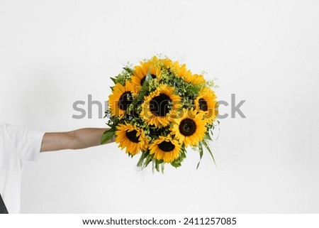 Bouquet of sunflowers handheld on white background isolated
